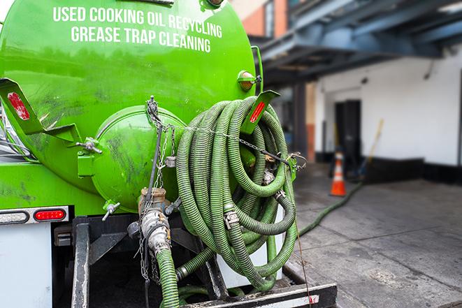 large truck pumping grease trap at a restaurant in Brentwood CA